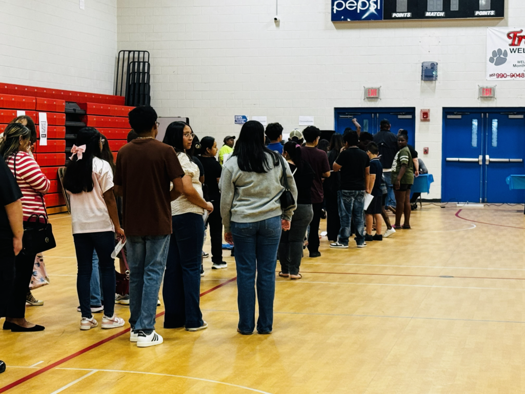 students standing in line for chromebooks