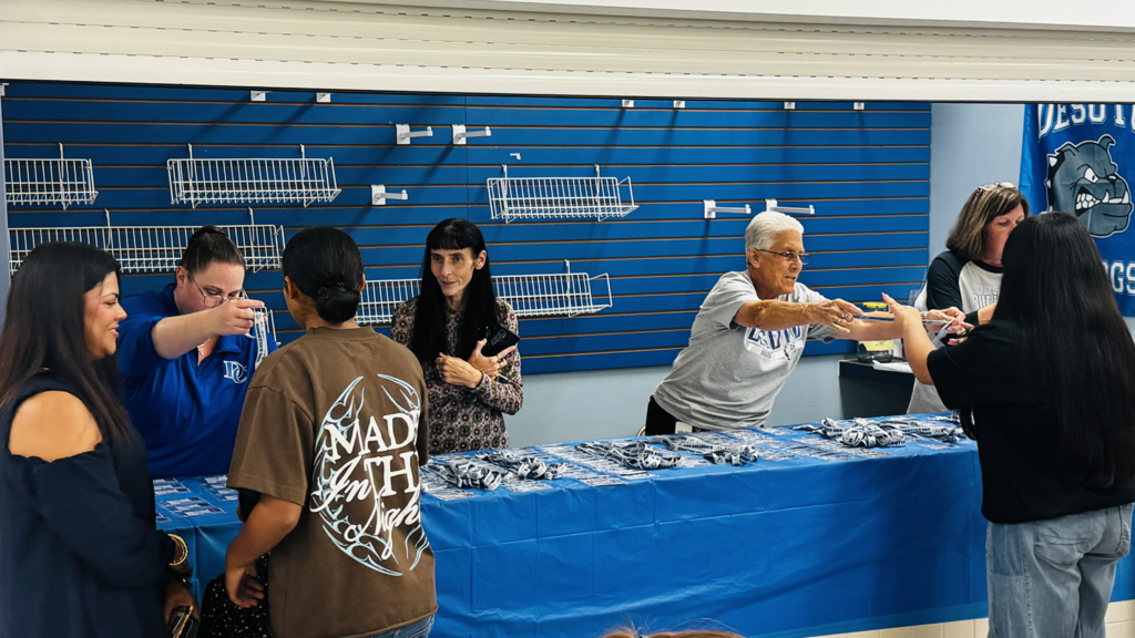 staff giving students their ID cards