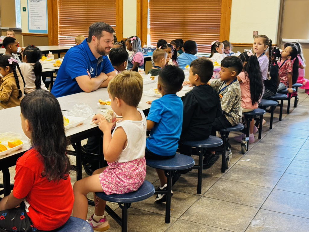man eating lunch with kids