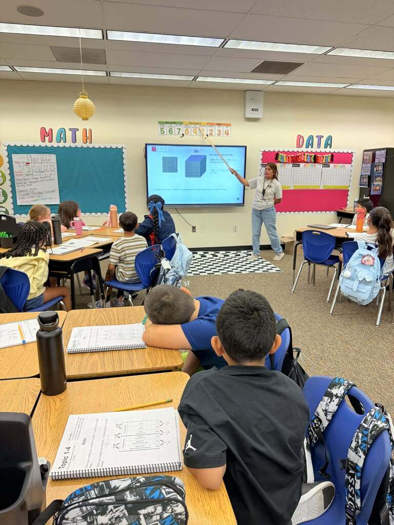 teacher teaching math to her students