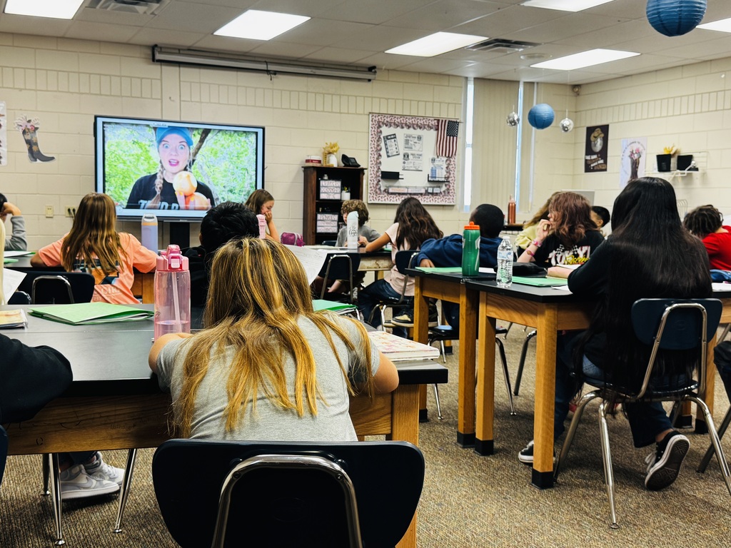 students watching a video and learning about cells