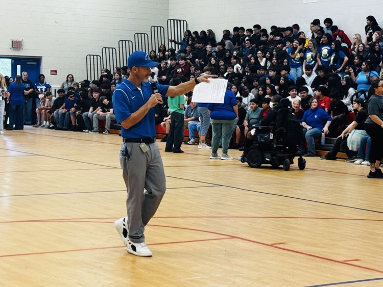 head coach speaking to the crowd