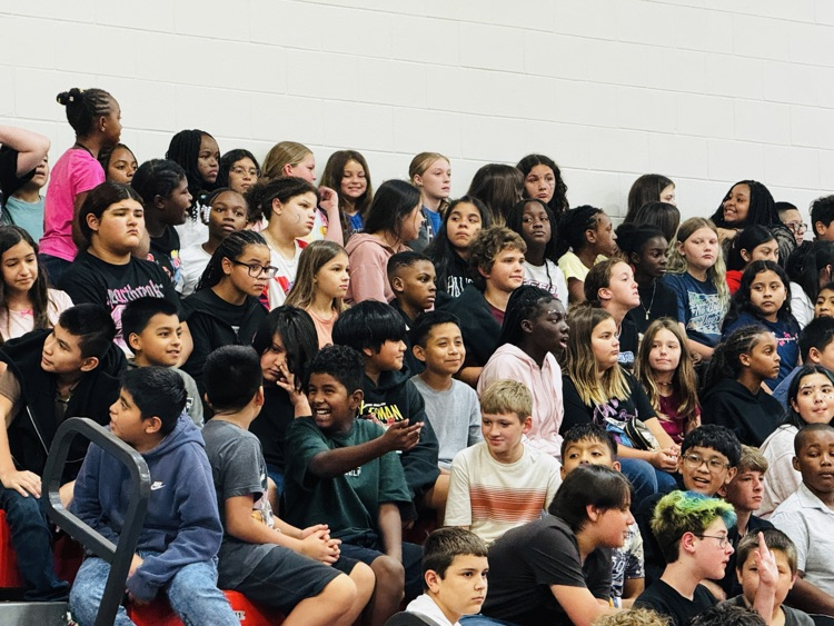 kids sitting at a pep rally