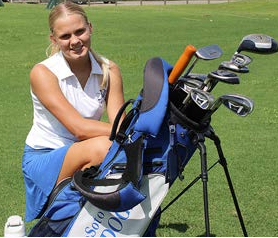 girl preparing to play golf