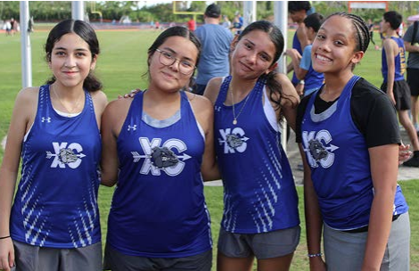 DHS girls cross country posing for a picture