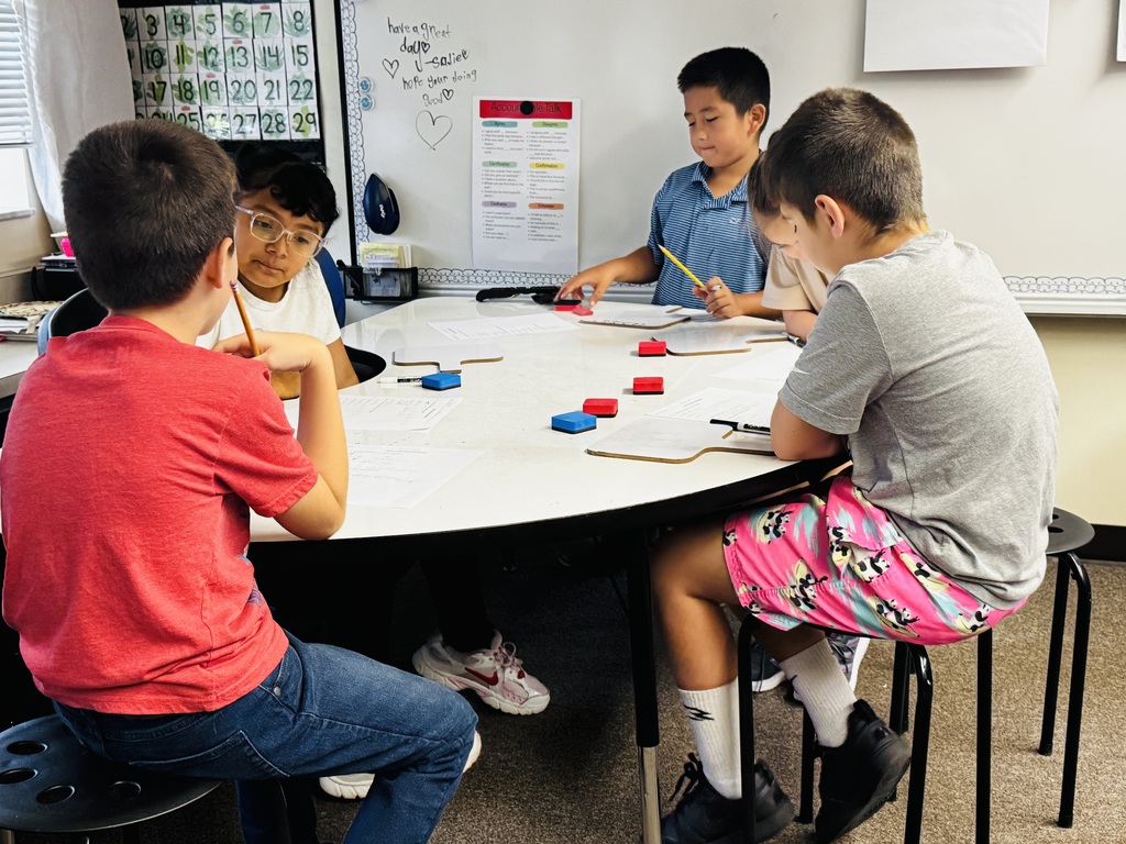 students at table ding small group assignment