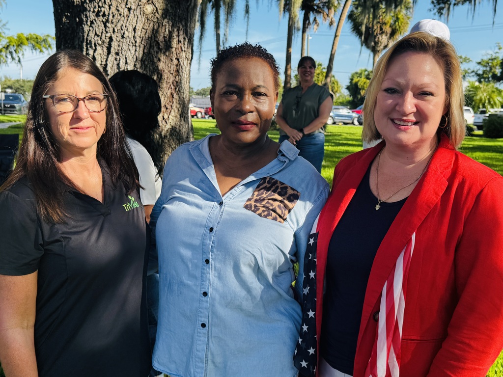 three school board members smiling for a photo