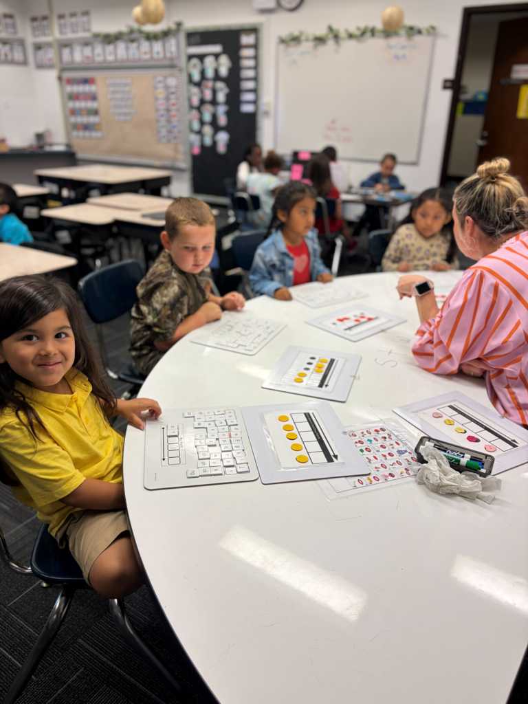 students in small group instruction with teacher