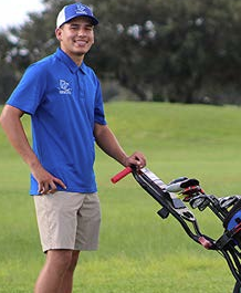 DHS golf student on the course posing for a picture