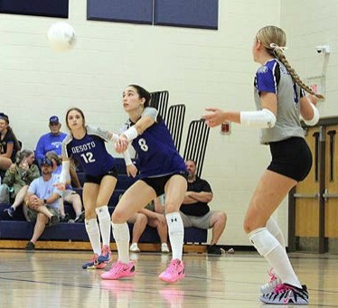 girls volleyball team in a live action game