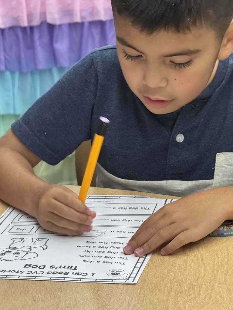 student doing classwork at the desk