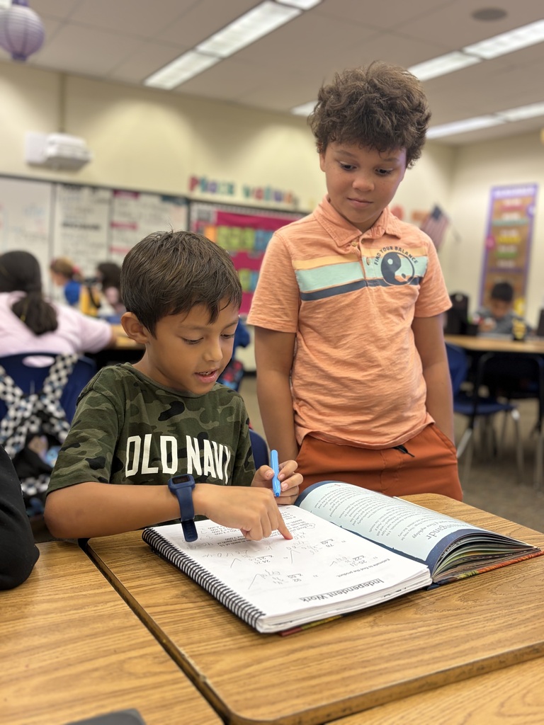 two students discussing classwork