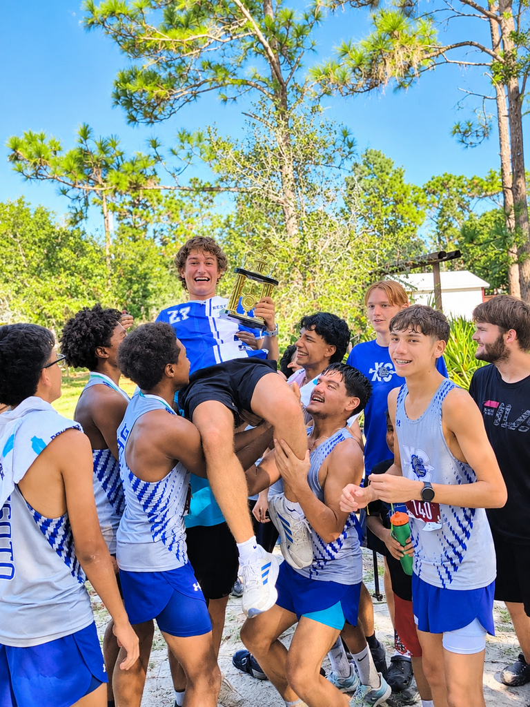 DHS XC team picking up one of their team mates