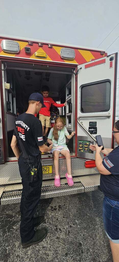 Desoto Fire & Rescue staff giving students a tour of an ambulance