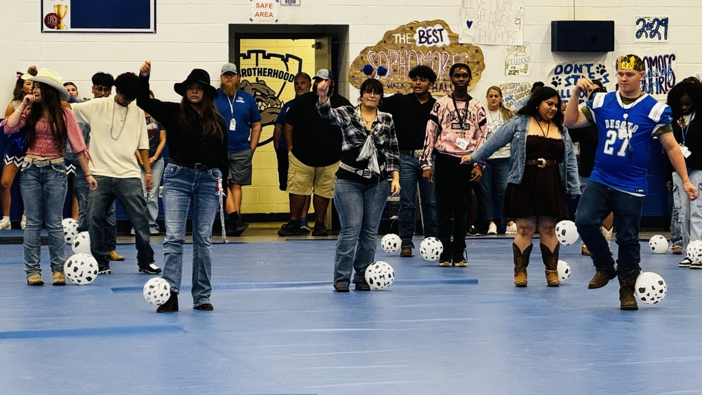 students at pep rally playing a game with balloons