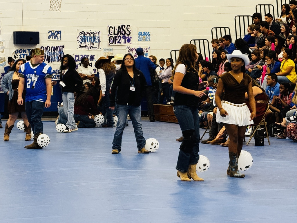 students at pep rally playing  a game