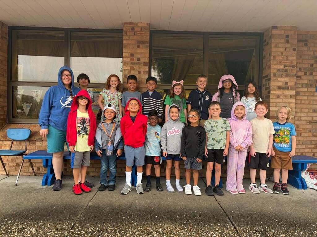 group of students dressed as Adam Sandler and smiling