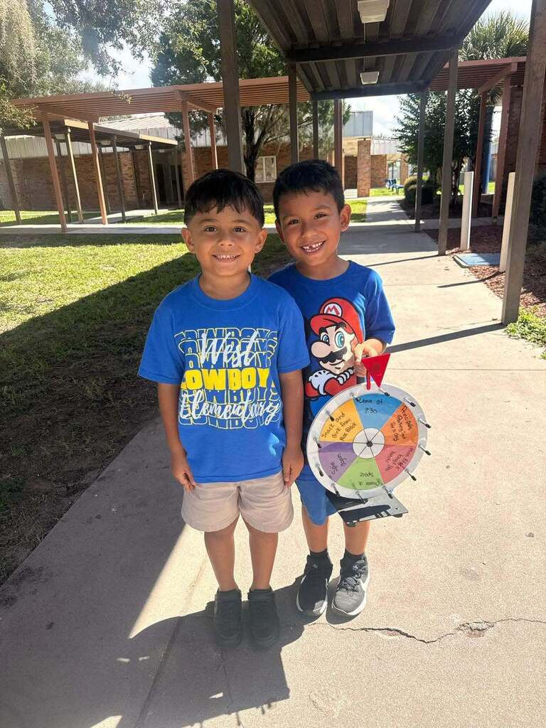 two boy students smiling