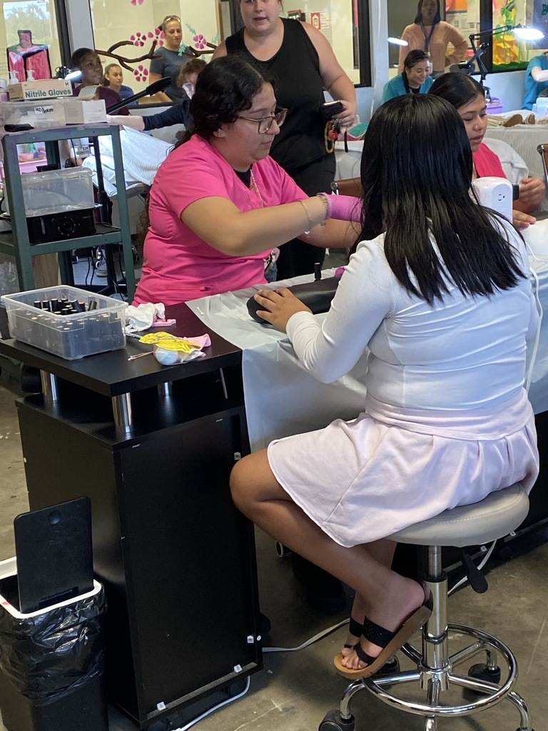 lady giving young girl a manicure