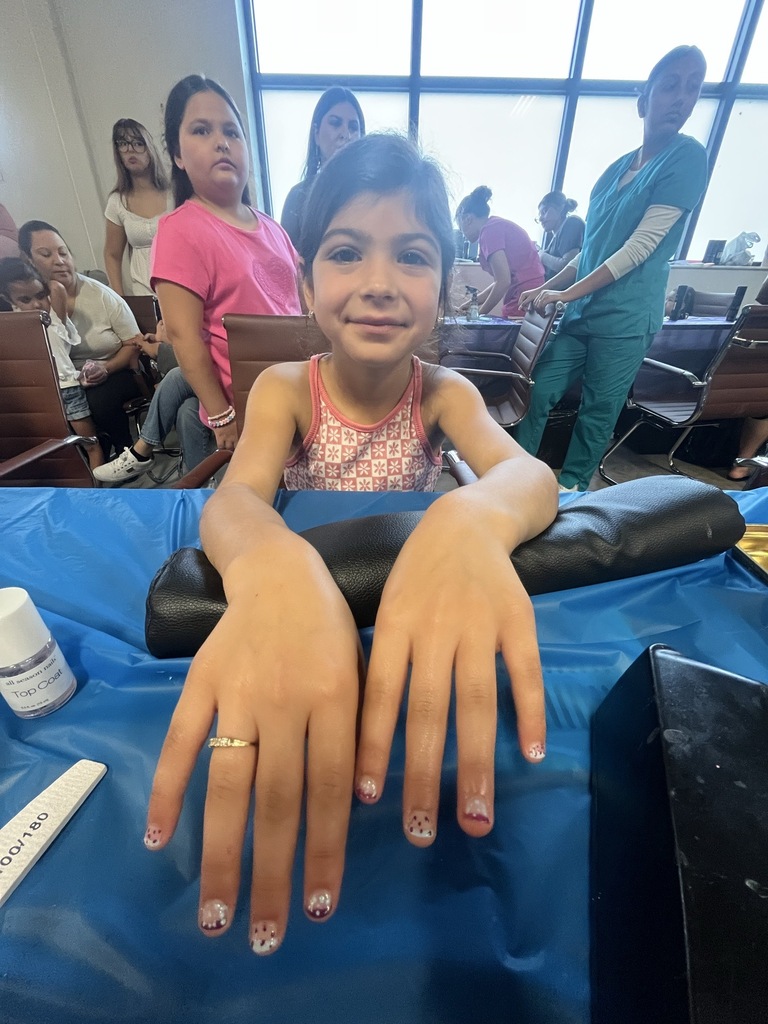 young girl posing for photo with nail art
