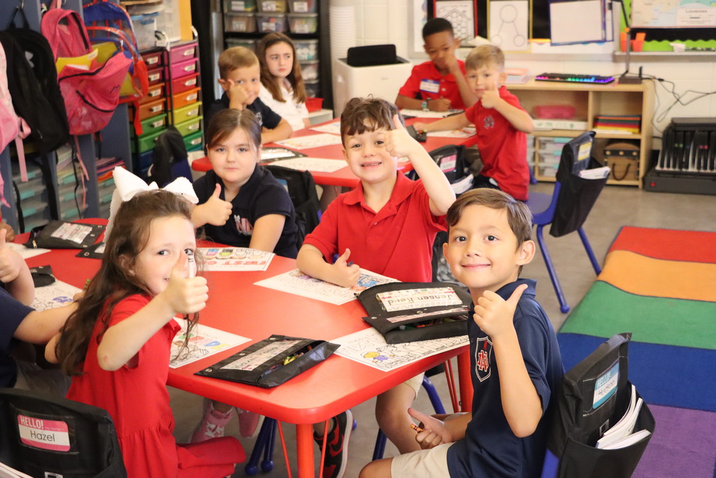 students giving a thumbs up-- 
