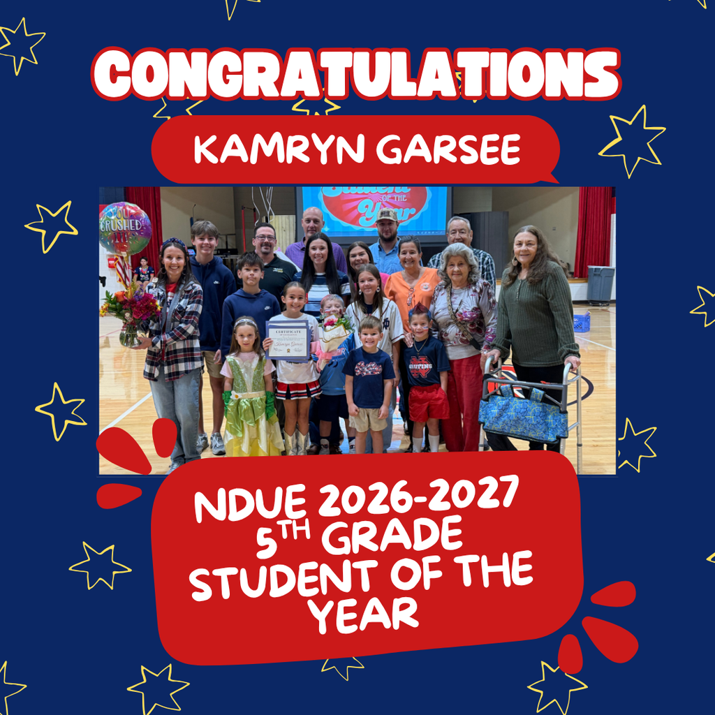 A group of smiling adults and children in a gym. A young person holds a certificate. Text reads, "Congratulations, Kamryn Garsee, 5th Grade Student of the Year."