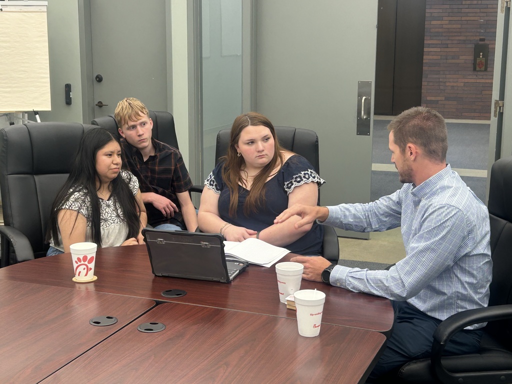 Engineering students discussing projects