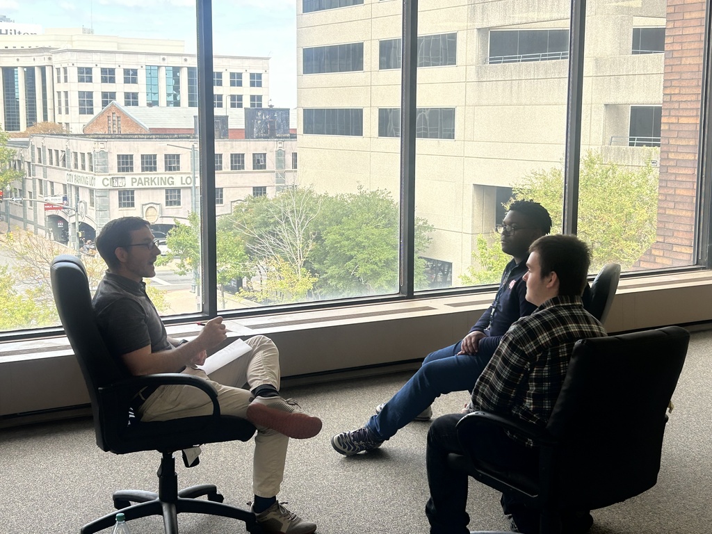Engineering students discussing projects