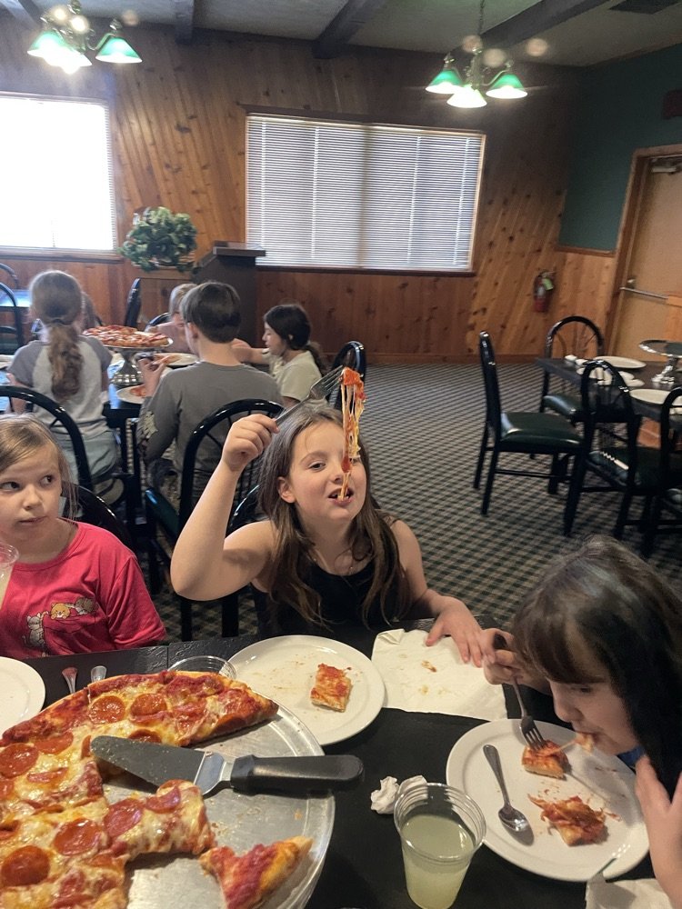 students enjoying pizza