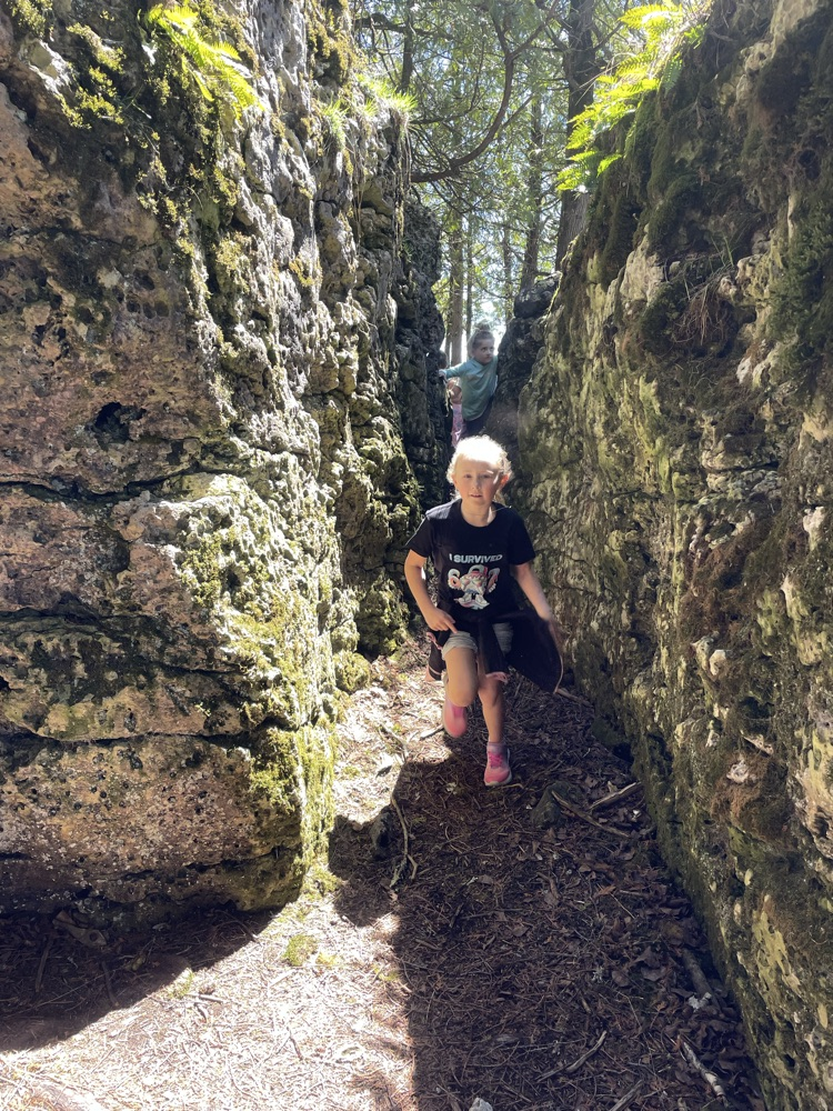 students enjoying running through the rocks