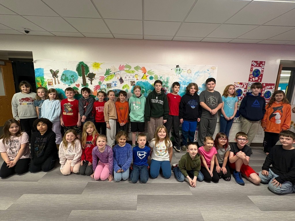 Drummond Island Elementary Students in front of their Earth Day project provided by PVG Volunteer.