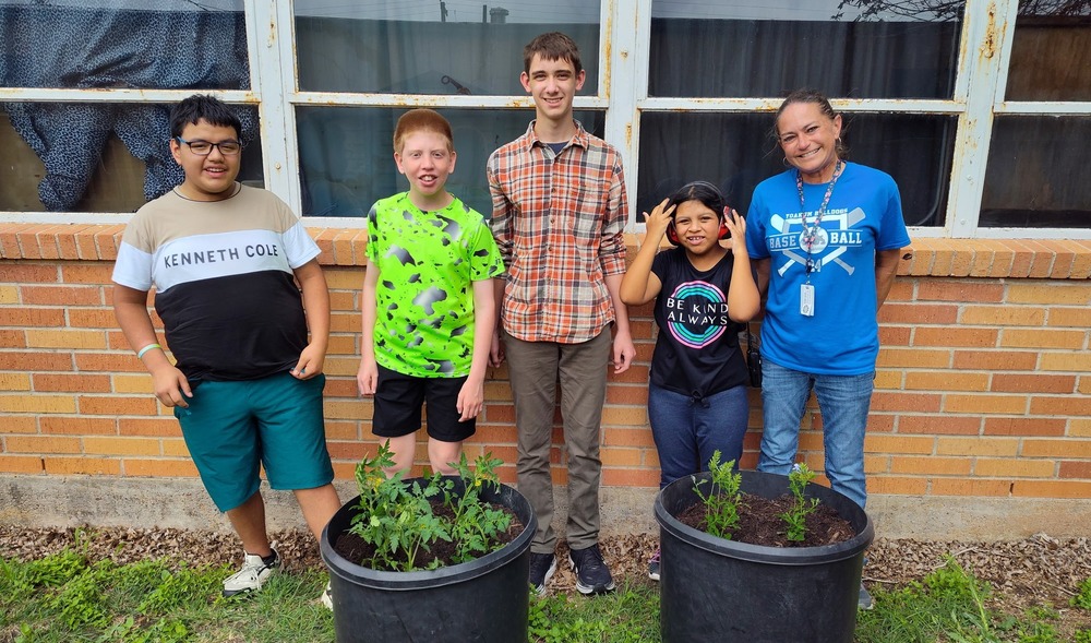 Mrs. Welch's class is doing some spring planting.