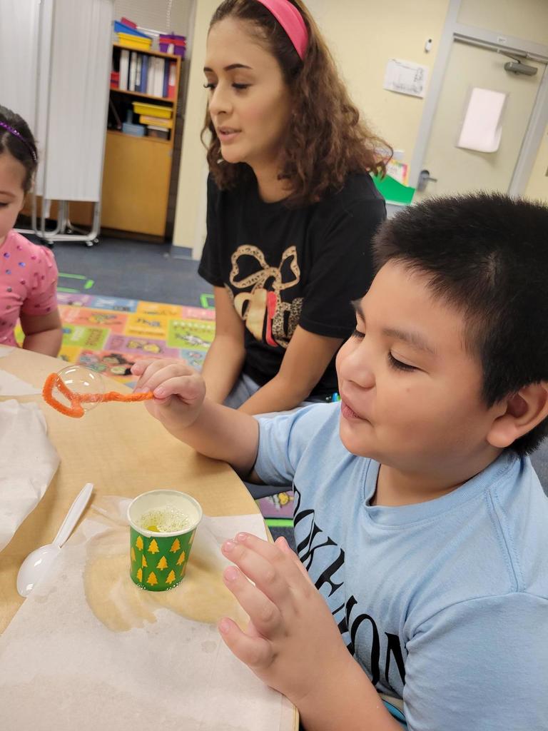 Mrs. Carlson's students exploring science and fine motor skills with bubbles