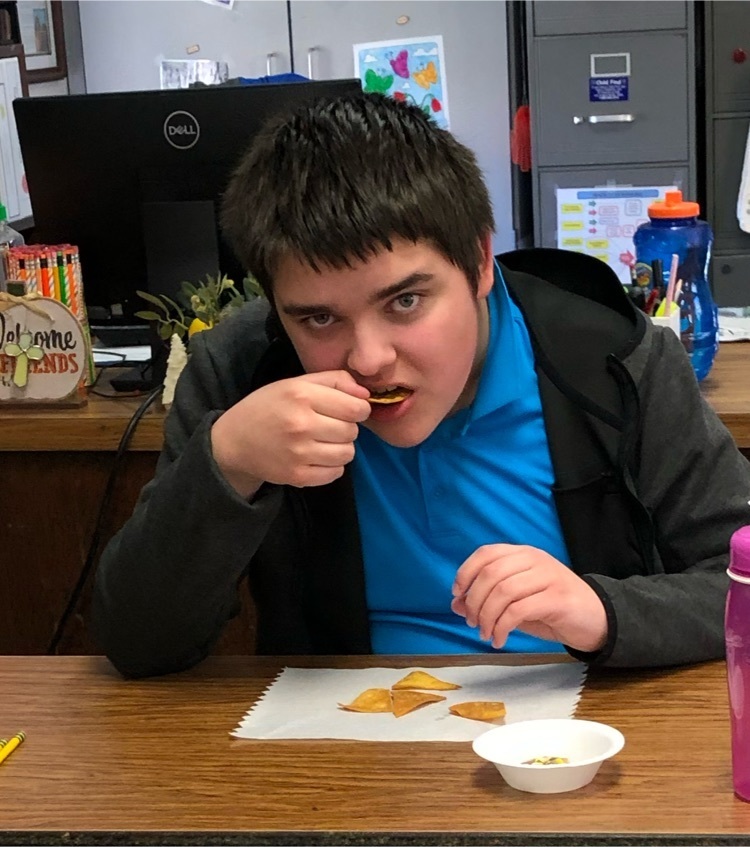 student tasting recipe