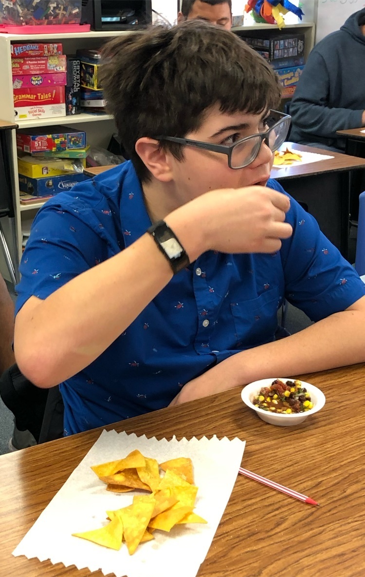student tasting the recipe