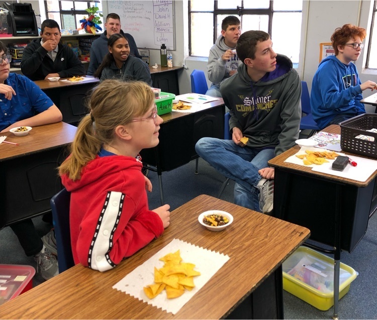students learning a cooking lesson