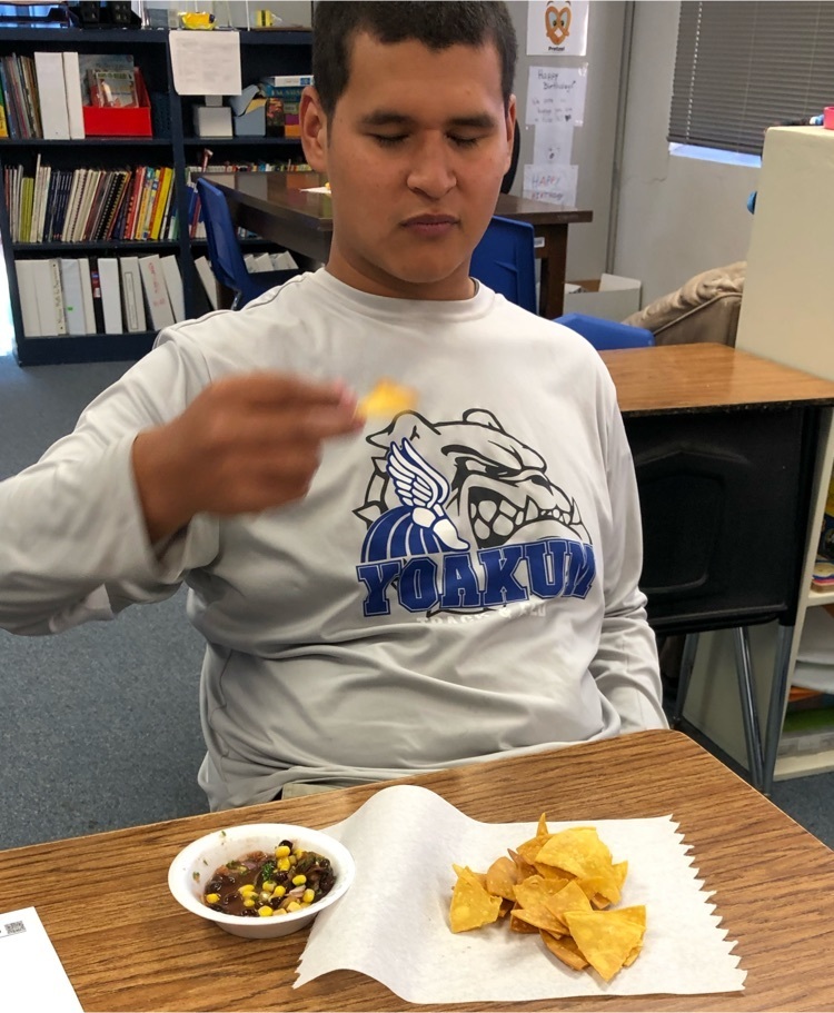 student tasting the recipe