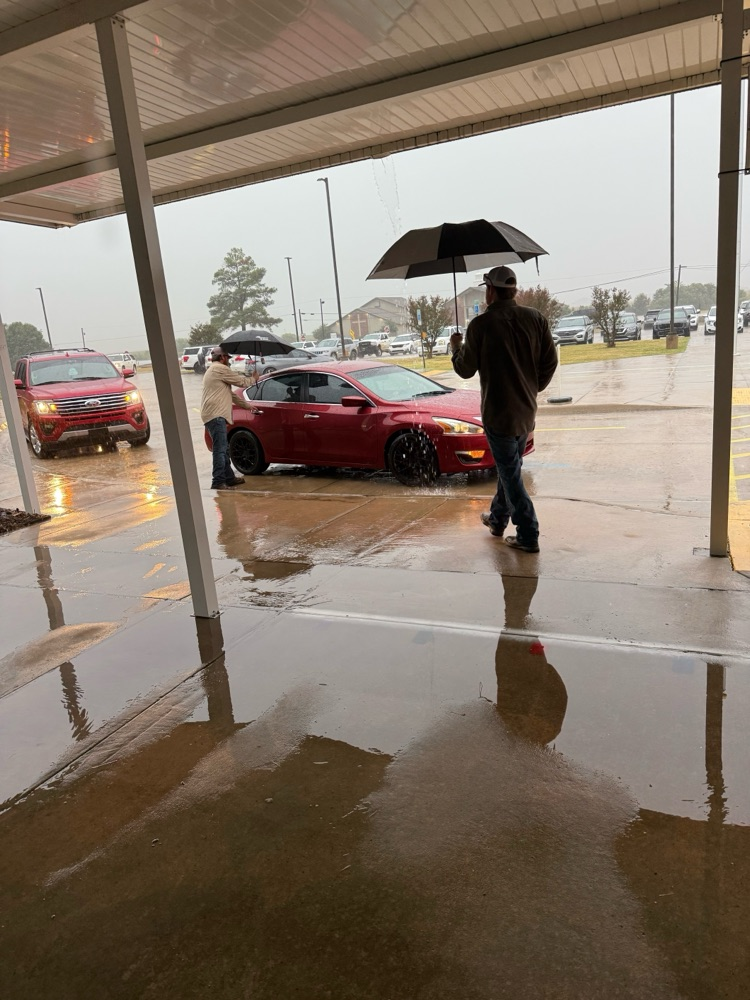 linemen opening car doors for students