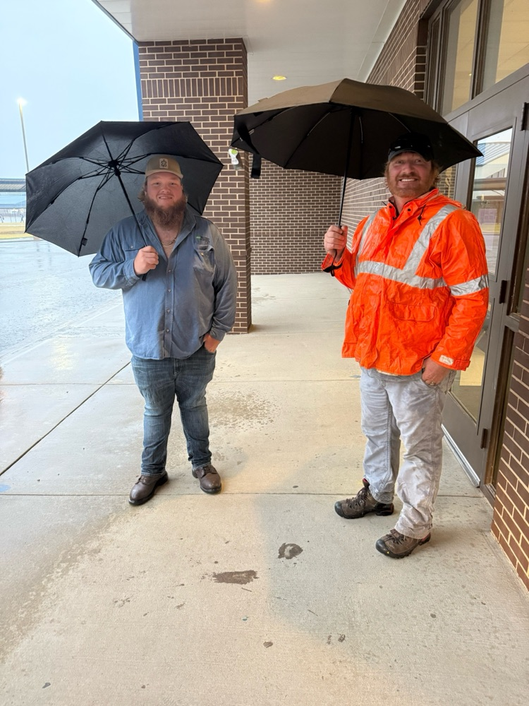 linemen opening car doors for students