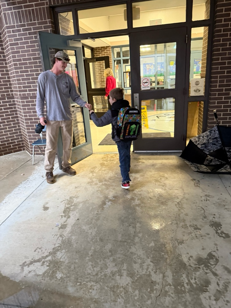 linemen opening car doors for students