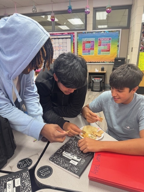 Students traveled to learning stations where they built background knowledge in order to fully understand and appreciate the story we were about to read, which was set in the Middle East. They researched conflict in the region, tried hummus, watched a slam poetry session, and made inferences on quality of life for citizens of that area in that time period.