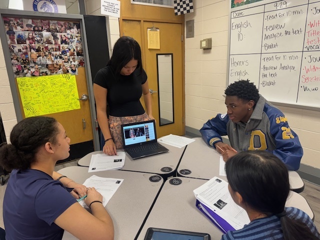 Students traveled to learning stations where they built background knowledge in order to fully understand and appreciate the story we were about to read, which was set in the Middle East. They researched conflict in the region, tried hummus, watched a slam poetry session, and made inferences on quality of life for citizens of that area in that time period.