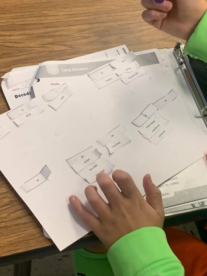 Students learning parts of a word