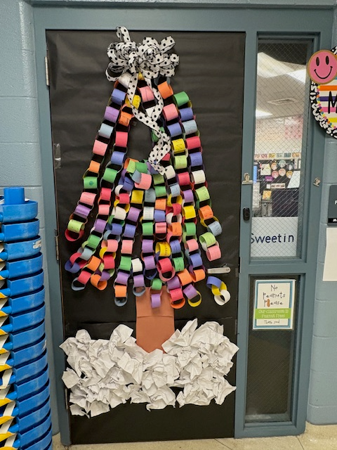 A classdoor decorate with christmas chain garland, arranged to form a tree