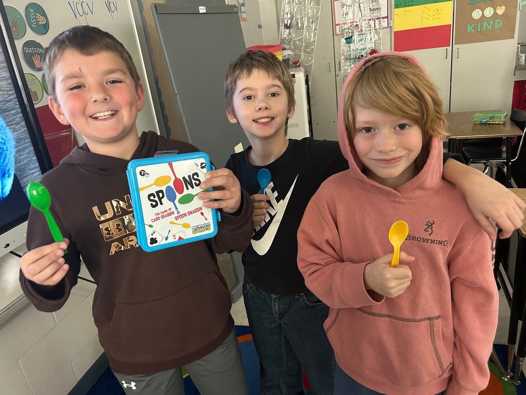 Students Playing the game of spoons with multiplication facts