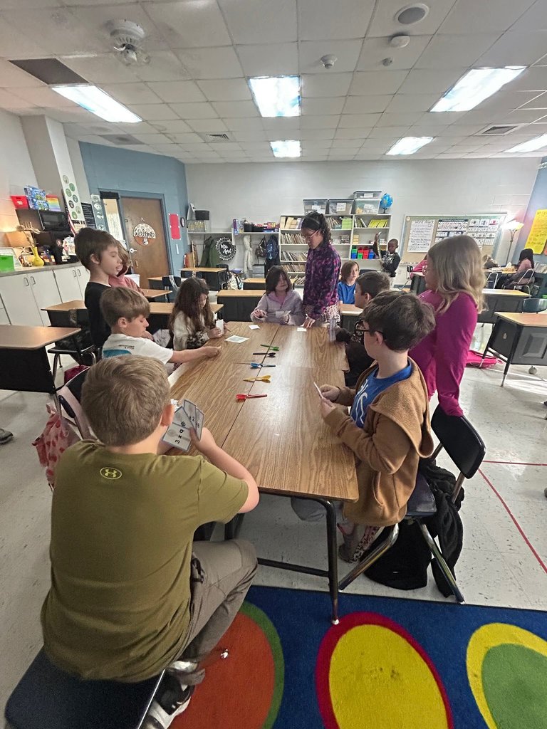 Students Playing the game of spoons with multiplication facts