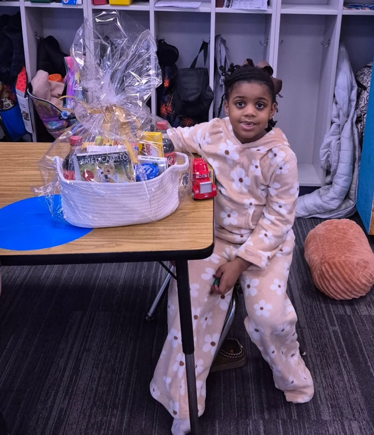 January Reading Challenge winner posing with a basket