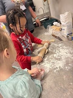 Pre-K Students using various size tools to help complete a task