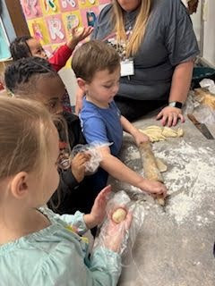 Pre-K Students using various size tools to help complete a task