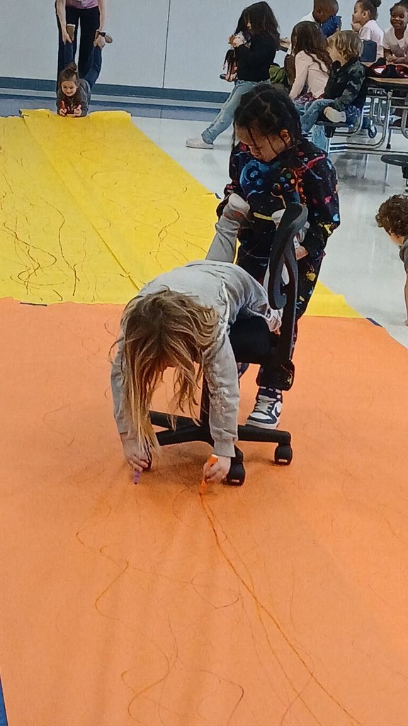 Pre-K Students using various size tools to help complete a task